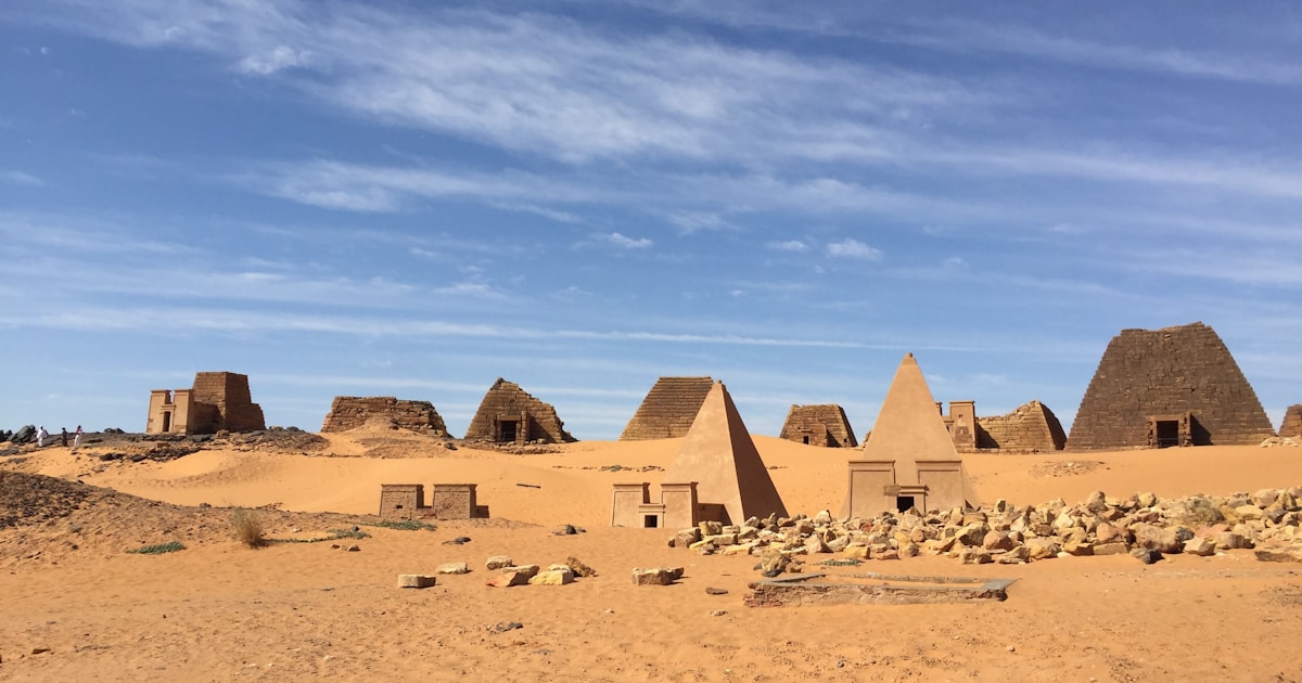 Sudanese refugees at a border crossing with UNHCR registration tent