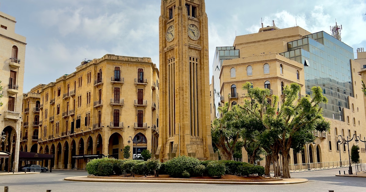 Beirut skyline with displacement, families moving to shelters