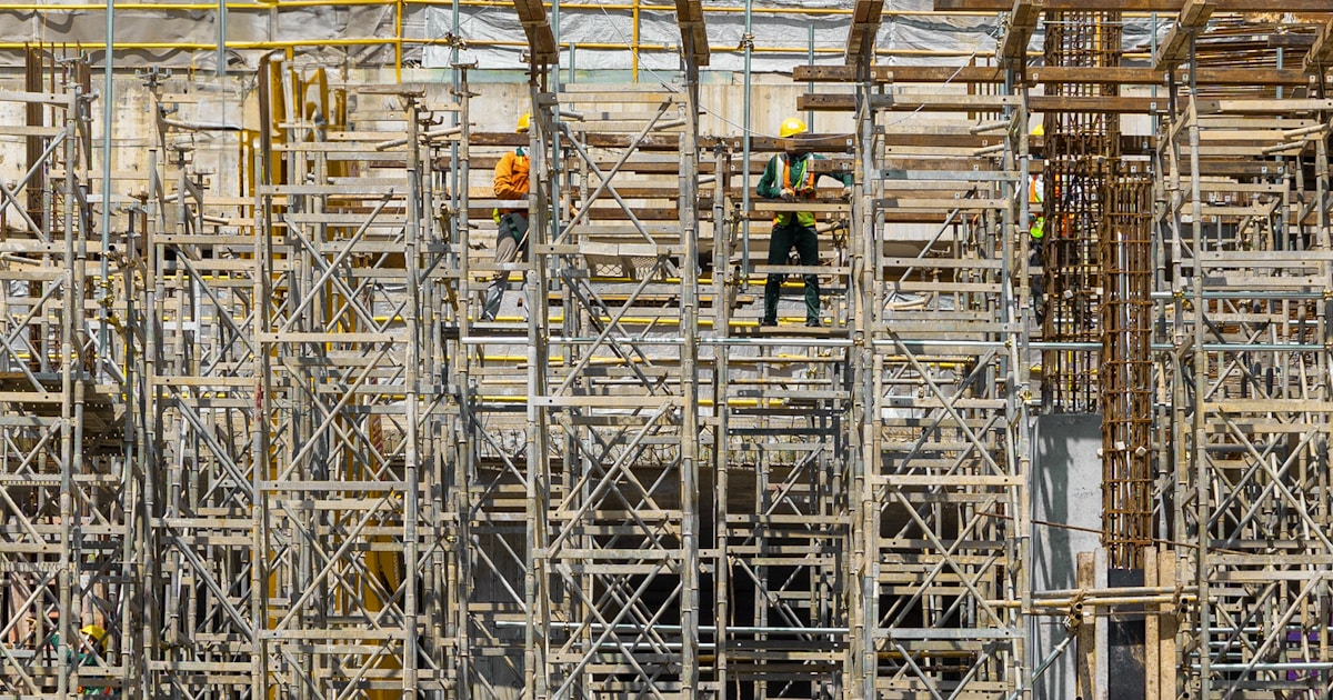 Migrant workers at an airport departure terminal